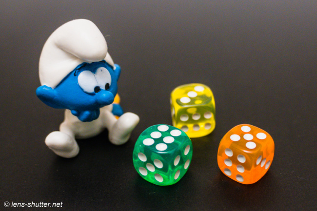 Baby Smurf Playing with Game Dices